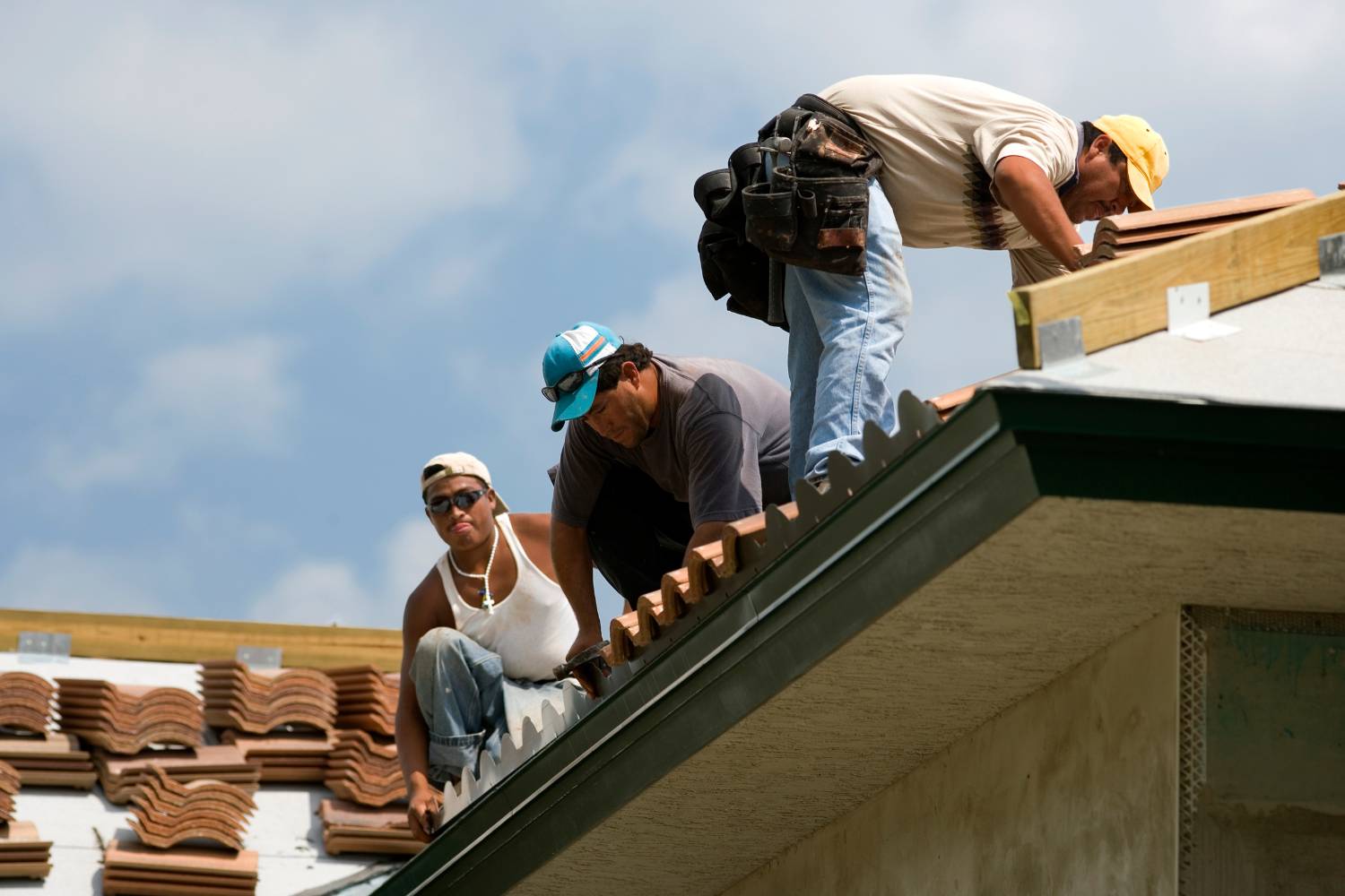 applying anti moss and algae treatments during roof restoration 1