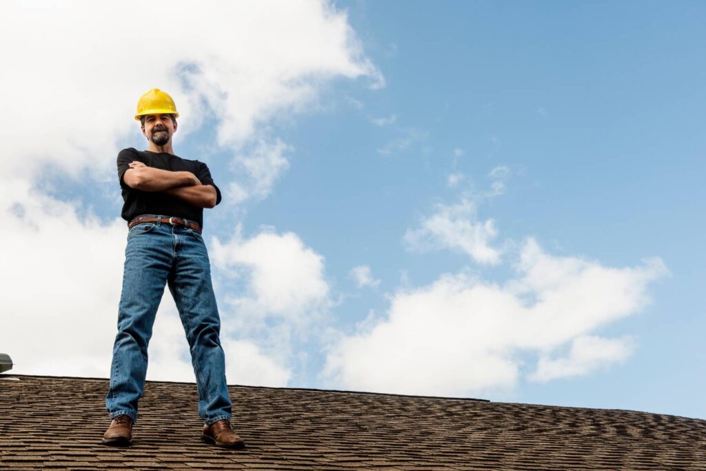 applying anti moss and algae treatments during roof restoration