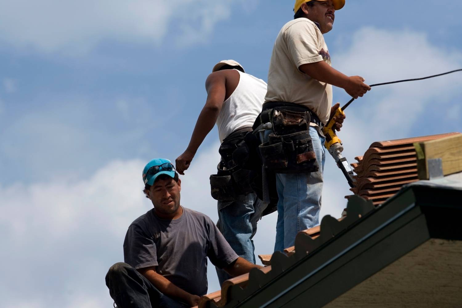 applying anti moss and algae treatments during roof restoration 2