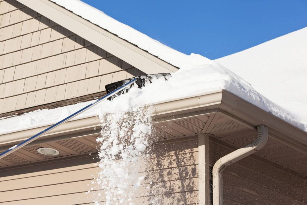 how do i deal with ice dams in my guttering