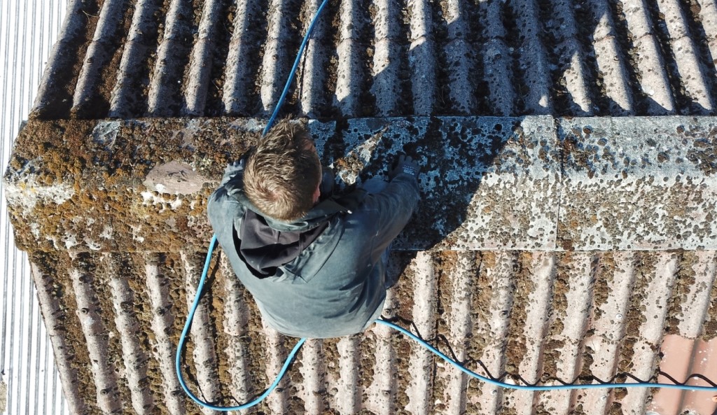 Man Cleaning Roof